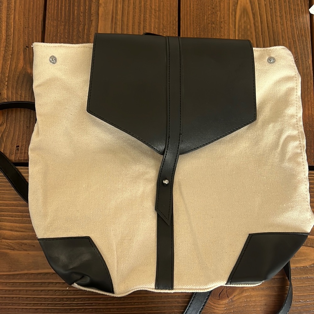Black leather and cream canvas backpack bag